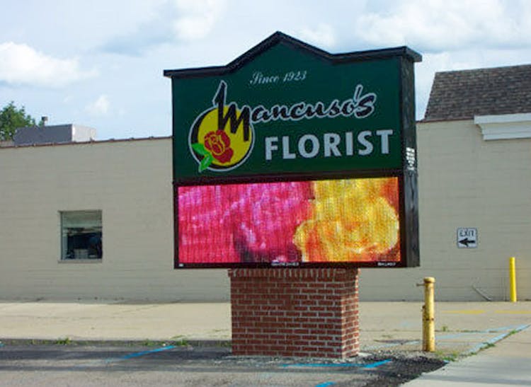 Our animated LCD sign shows off the latest arrangements in full color